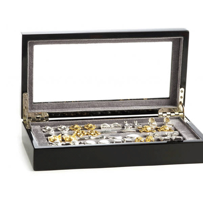 Don’t just leave your favorite pair of cufflinks to get lost in your sock drawer. Consider this stunning designer wood storage case instead. Made from solid oak, this Junior Cufflinks Collector’s Case has everything you need to keep tabs on your favorite cufflinks.
